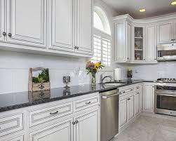 Next, you can build up a modern look by combining antique white kitchen cabinets with black appliances. Glazed Cabinets Add Traditional Depth Dimension To Any Kitchen New Kitchen Cabinets Refacing Kitchen Cabinets Refacing Kitchen Cabinets Cost