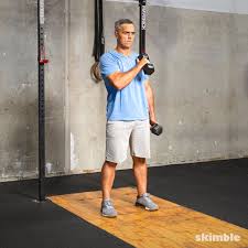 Stand holding two dumbbells by your sides, palms facing towards each other. Cross Body Hammer Curls Exercise How To Workout Trainer By Skimble