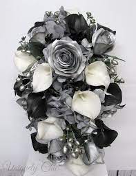 This look is especially cool because the marble charger brings in specks of black as well. 27 Black Silver White Wedding Ideas Wedding Wedding Bouquets Black White Wedding