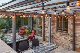 Outdoor Patio With Industrial Style Outdoor Lighting Light Stacked Stone Veneer Stone Fire Pit Stone Bar Counter And Re Patio Red Patio Red Patio Furniture