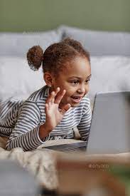Cute African American Girl using Video Chat Stock Photo by seventyfourimages