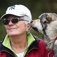 Thomas David Schall with dog and woman at Columbia microphone]