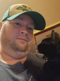 My boy cat is currently lying