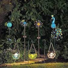 As the sun sets and dusk settles in, your beautiful glass stake glows from within. Solar Sun Moon Garden Stake Set Solar Garden Stakes Solar Lights Garden Moon Garden