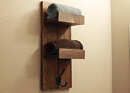 This precious wooden model of towel rack is made of rustic recycled wood planks and comes in form of a durable ladder that will carry the towels over its spindles. Wooden Towel Rack My Decorative