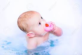 There should be big, sudsy bubbles floating on top of the water. Cute Baby Boy Takin A Bubble Bath With Foam Playing In Water With A Rubber Duck Toy After Shower Stock Photo Picture And Royalty Free Image Image 30965969