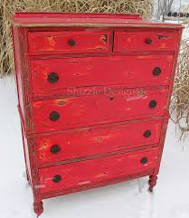 Featuring recycled wood and artfully distressed paint, the color and finish of our side table will vary by the piece, making this accessory the perfect unique addition to your home. Shizzle Design Funky Chunky Distressed Red Highboy Dresser