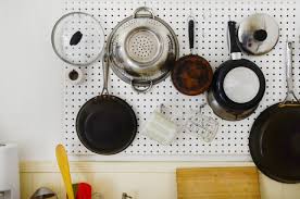 You can avoid the issue even further by opting for a metal mesh adjustable pot lid organizer. 10 Clever Pot Lid Organizer Ideas How To Store Pot Lids Kitchn