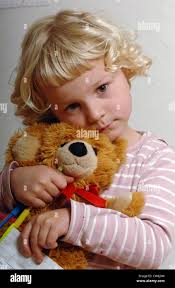 Comforted by teddy bear hi-res stock photography and images