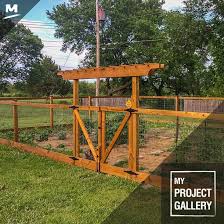 This Fence Made For A Beautiful Enclosed Garden The Double Wide Gate Fits A Lawn Tractor And Pr Enclosed Garden Structures Garden Enclosure Ideas Fence Design