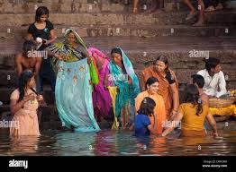 Women bathing washing clothes in hi-res stock photography and images - Alamy