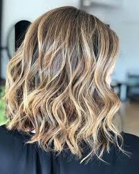 Tousled curls are, definitely, the best texture to present this color. 50 Best And Flattering Brown Hair With Blonde Highlights For 2020