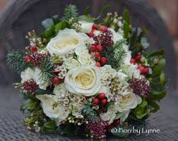 Bridal bouquets for a christmas wedding can reflect the holiday season. Wedding Flowers Blog Jenny S Traditional Christmas Wedding Flowers Rhinefield House New Forest