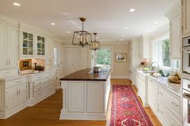 White is the style of today, tomorrow, and possibly forever, and raised panel cabinets, although usually formal, are popping up in all sorts of kitchens these days. White Raised Panel Kitchen Crystal Cabinets