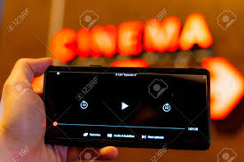Not only can you stream episodes directly from the app, but you can also download them to your device's memory and watch them later without an internet connection. Slow Internet Video Load And Download Speed Watching Movie Online Loading Icon On Screen Hand With Black Empty Screen Mobile Phone Background Red Wall With Cinema Signate Stock Photo Picture And Royalty