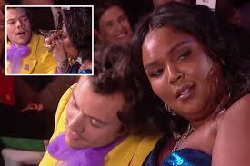 Brits 2020: Harry Styles and Lizzo's flirting sends fans wild as she kisses  his hand