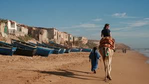 Camels awaiting tourist who they will take for a ride in the sands. How To Ride A Camel Like A Pro In Morocco Intrepid Travel Blog