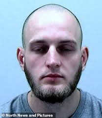 Moment gun-wielding robber is chased out of petrol station by 'heroic'  worker armed with a stool