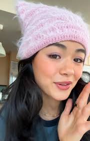 Edit: Down the rabbit hole we al went! It is the Mylo Fuzzy Beanie from  Urban Outfitters (which is no longer available). I ordered some of Ice's  eyelash yarn that I will