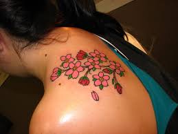 Bow tattoo on front shoulder. Popular Shoulder Tattoo Designs For Women
