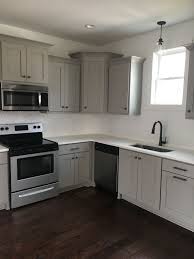 Gray Kitchen Cabinets White Quarts Countertops Subway Tile Backsplash Br Farmhouse Style Kitchen Cabinets Light Grey Kitchen Cabinets Kitchen Cabinet Design