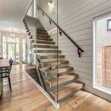 This stunning stairway with simple black and white artwork goes perfectly with the textured wall. China Indoor House Staircase Design Stairs Glass Wood Stairs Floating Staircase China Solid Wood Oak Wooden