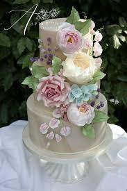 Melissa Marble Wedding Cake Decorated With A Cascade Of Handmade Sugar Flowers David Austin Roses Peonies Cake Lavender Wedding Cake Wedding Cake Designs