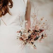 Although you may think of fall wedding bouquets being full of fall colors, it is completely fine to stay imagine pink peonies mixed with a variety of leaves and vines. Love These Shades Of Pink That The Evoke Amber Brown Tones Also Love How The Dark Background Is P Wedding Bouquets Wedding Flowers Wedding Flower Inspiration