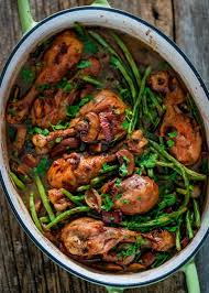 Coq Au Vin This French Dish Is Made With Chicken Braised In Red Wine With Mushrooms Onions And Green Beans Lots Of Herbs P Coq Au Vin Wine Recipes Recipes