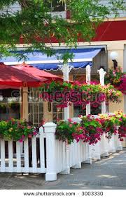 Outer View Stock Photo Pretty Restaurant Patio Decorated With Purple Petunia Flower Boxes And Outdoor Restaurant Patio Restaurant Patio Petunia Flower