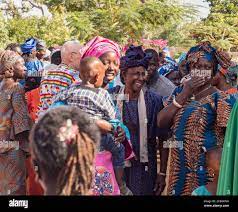 Senegal, Africa - January 2019: African people in colorful clothes(boubou)  meet after the mass at a Catholic church in West Africa Stock Photo - Alamy