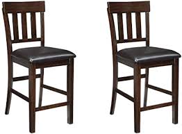 Stylish bar stools provide a sense of authenticity and comfort to your home bar or kitchen counter experience. Amazon Com Signature Design By Ashley Haddigan 24 Counter Height Upholstered Barstool Set Of 2 Dark Brown Furniture Decor