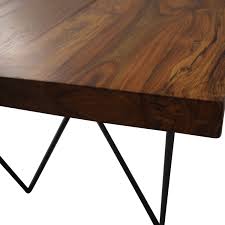 Table extensions (called leaves) are placed in the center gap. 62 Off Cb2 Cb2 Dylan Dining Table Tables