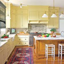 The blue color on the kitchen cabinets: Editors Picks Our Favorite Yellow Kitchens This Old House