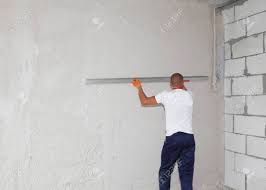 Maybe you would like to learn more about one of these? A Handyman Building Contractor Is Skim Coating Finishing Plastering Stock Photo Picture And Royalty Free Image Image 147331133