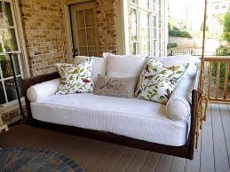 A beautiful mess has a diy porch swing plan that uses primarily 2x4's to create a classic looking swing that would look great on any porch. Outdoor Porch Beds That Will Make Nature Naps Worth It