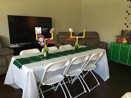 Table Runner Was The Field With Field Goal Post As Centerpiece Football Was Mason Football Table Centerpiece Football Baby Shower Theme Football Baby Shower