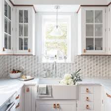Gorgeous U Shaped White Kitchen Features A A Window Lit By A Glass Pendant Hung Above A Far Kitchen Remodel Small Small U Shaped Kitchens Small Kitchen Layouts