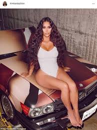Kardashian exotic cars kim kardashian race car kim kardashian sliver car kim kardashian car meme kim kardashian climbing into car. Kim Kardashian Sits Atop A Car To Celebrate The One Year Anniversary Of Skims Daily Mail Online