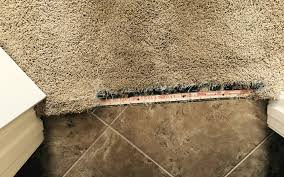 You are now going to take the transition strip and place it over the seam where the carpet and material meet. Scottsdale Doorway Transition Repair Scottsdale Carpet Repair