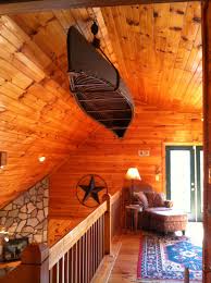 90 Year Old Canoe Hanging From The Ceiling In The Cabin Houseboat Decor Log Home Interiors Boat Decor