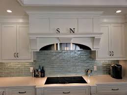 In this case, a rich tuscan look is achieved with cream tiles offset by a tile centerpiece or medallion. Glass Tile Backsplash Pictures Novocom Top