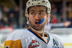Dawson Davidson of the Saskatoon Blades stands