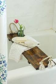 You'll want to have a piece of wood cut to slightly larger than the bathtub width so that it hangs. Bath Caddy