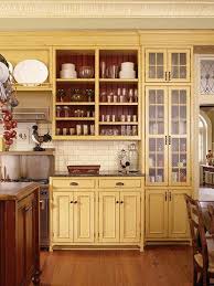 15 Ways To Update Your Kitchen With Paint Yellow Kitchen Cabinets Painting Kitchen Cabinets Kitchen Interior