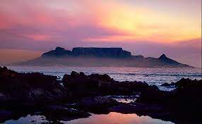 Whether it is covered in a blanket of clouds or showing off against a brittle cloudless blue sky table mountain frames the northern ending of the cape fold mountain range. Table Mountain Cape Town South Africa Visit All Over The World