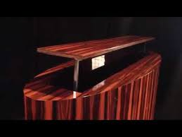 From style to features to accessibility, your choice of cabinetry requires as much thought as your av equipment. Macassar Ebony Oval Tv Lift Cabinet Hides 65 Inch Flat Screen Youtube
