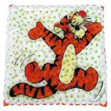 This amazing bespoke winnie the pooh funeral tribute is made from a 24 x 24ins oasis designer board. Funeral Flowers Bespoke Tigger Tribute 140