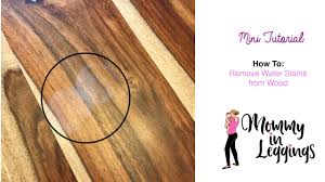 Someone sets a glass on a wooden tabletop. How To Remove Water Stains From Wood Youtube