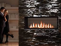 The star of this living room remodel by kristin at hunted interiors is the big brick tile in a magnificent shade of taupe. Linear Fireplace Design Ideas Linear Gas Fireplace Ideas Stone Fireplace Surround Restaurant Fireplace Linear Fireplace Fireplace